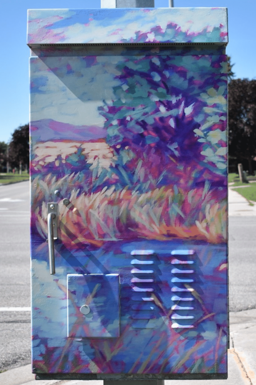 Utility box with artwork of watercolour tree and wild grasses